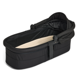 Open canopy black Carry Cot 3 with beige interior on a white background